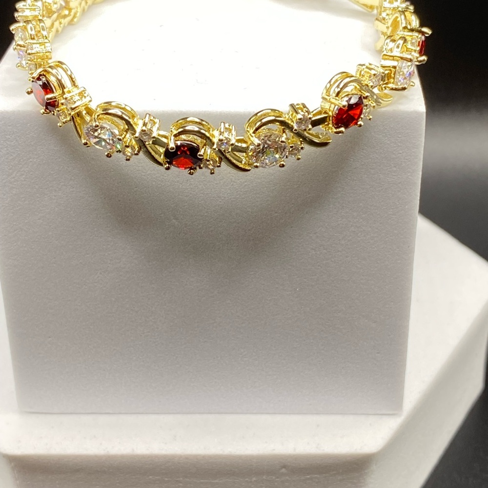 Elegant Gold Tone Bracelet with Garnet and CZ